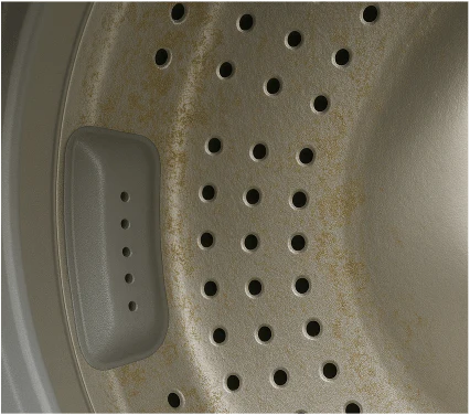 Washing machine with trapped pet odour and dander buildup before treatment
